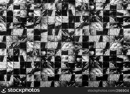 Abstract background from dark marble pattern on wall.
