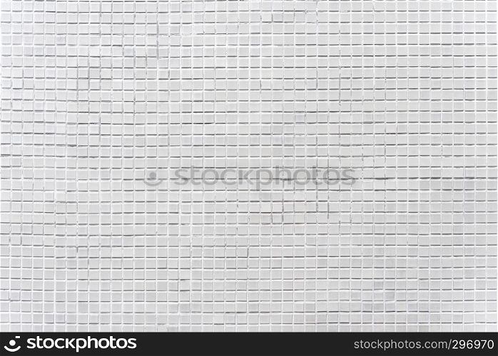 Abstract background from decorated grey bricks mosaic tiles on wall. Vintage and retro background.