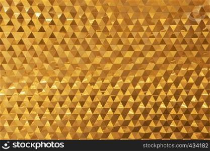 Abstract background from golden brick decorated on wall. Modern wallpaper.