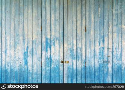 Abstract background from old wooden plank pattern on wall with grunge. Weathered blue painted in vintage or retro style.