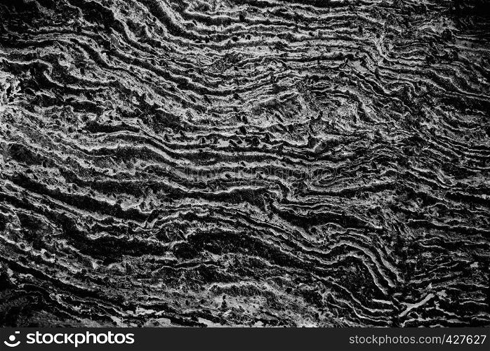 Abstract background from texture of black marble in natural with light. Retro and vintage backdrop. Picture for add text message. Backdrop for design art work.