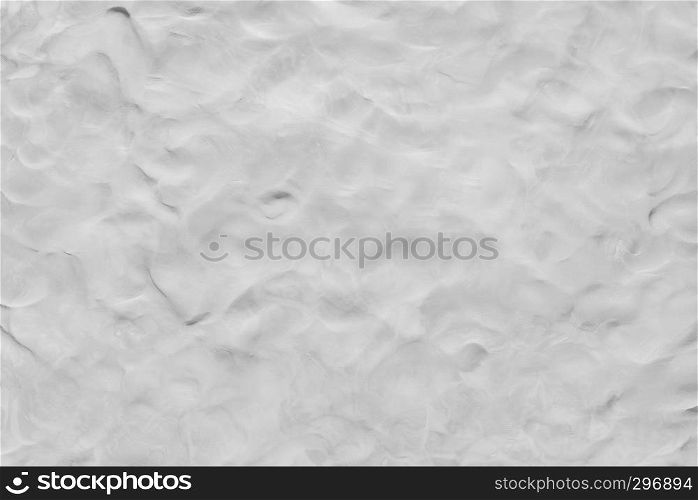 Abstract background from white clay texture on wall. Monochrome art wallpaper.