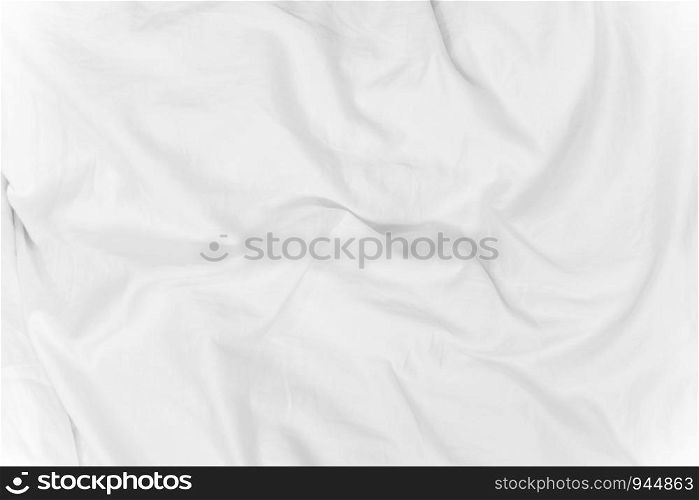 Abstract background from white corrugated fabric texture on bed with sunlight in the morning.