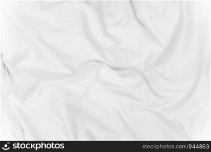 Abstract background from white corrugated fabric texture on bed with sunlight in the morning.