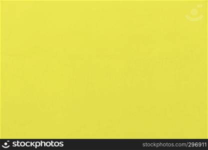 Abstract background from yellow concrete wall. Free space for text.