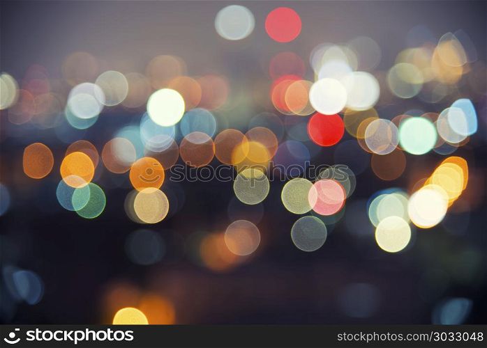 Abstract background image of circular bokeh motion blurred stree. Abstract background image of circular bokeh motion blurred street light background of city, traffic light from car on street at night time.