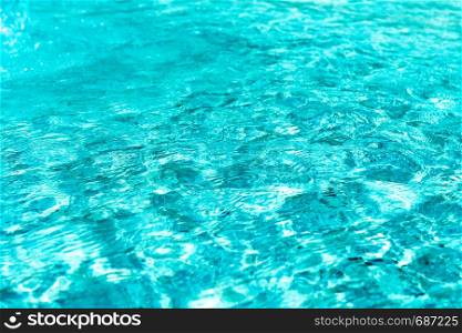 Abstract background of a blue and wavy water surface in a swimming pool or spa jacuzzi