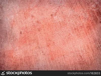 Abstract Background of a concrete wall fragment in red color. abstract background with blue texture