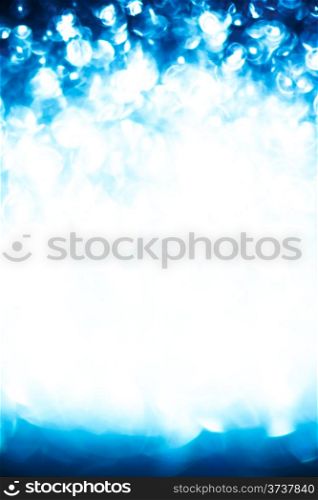 Abstract background of blue holiday lights with copy space.