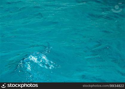 Abstract background of blue surface water with a wave