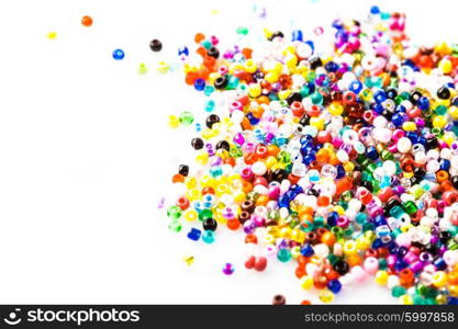 abstract background of close up multi colored beads on white. The beads background