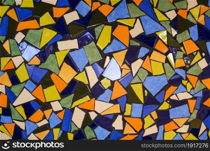 Abstract background of colorful broken tiles in mosaic seamless pattern for interior wall and floor decoration, reuse and recycling concept
