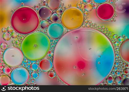 Abstract background of colorful oil drops on water surface. Abstract background of colorful oil drops on water