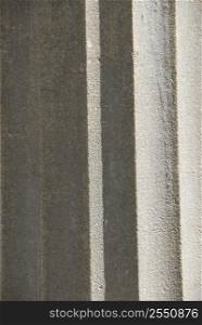 Abstract background of grey concrete column fragment