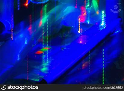Abstract background of motion blurred neon lights under ultraviolet lamp.. Motion Blurred Neon Lights