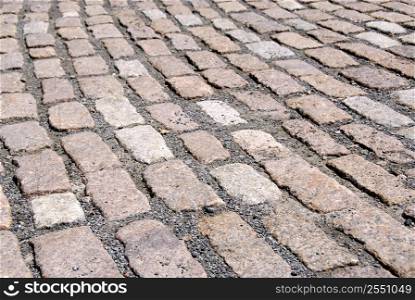 Abstract background of old granite cobblestone pavement