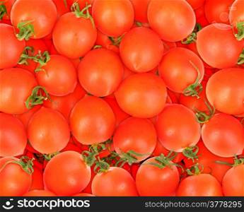 Abstract background of ripe red tomatos. Close-up. Studio photography.
