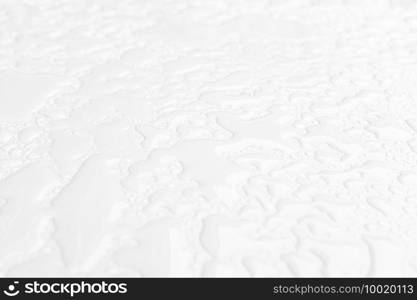 Abstract background of wet white surface with raindrops. Close up