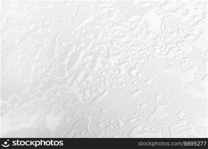 Abstract background of wet white surface with raindrops. Close up