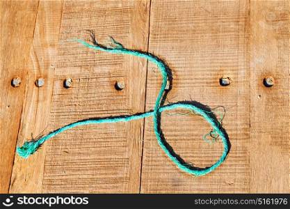 abstract background texture of a brown antique wooden floor and rope