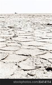 abstract background texture of the desert of salt in africa ethiopia danakil region of afar concept of wilderness and danger place with car