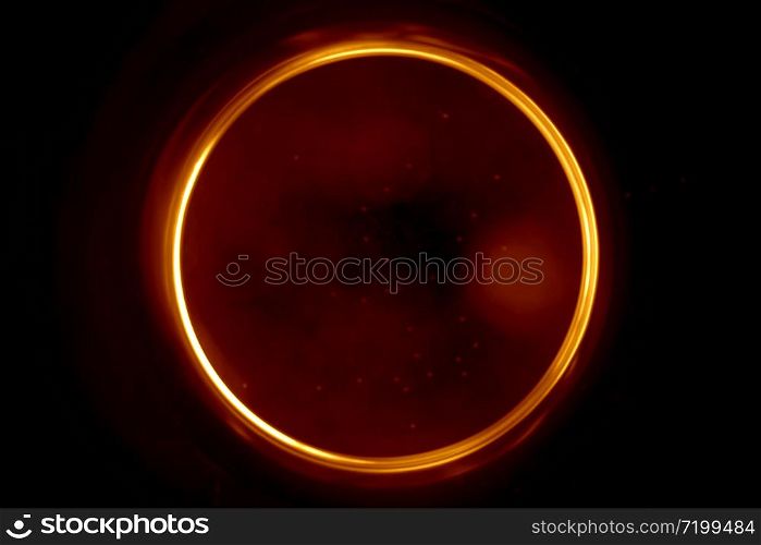 Abstract background with a black hole in blur. Blurry image of a black hole. Sphere on black background.