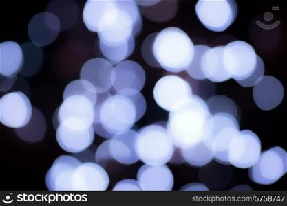 Abstract background with blur spots of small blue lanterns