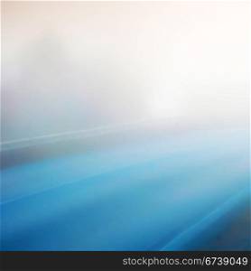 Abstract background with blurry roadbed. Empty space for text or other content