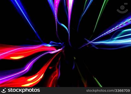 abstract background with multicolored motion blured lines on black