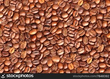Abstract background with pile of roasted black coffee beans. Close-up. Studio photography.&#xA;