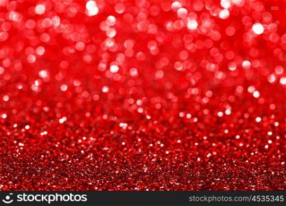 Abstract background with red shiny glitter bokeh lights