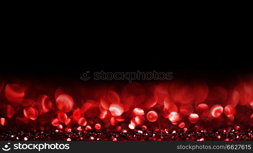 Abstract background with red shiny glitter bokeh lights. Bokeh lights background