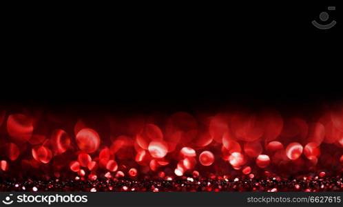 Abstract background with red shiny glitter bokeh lights. Bokeh lights background