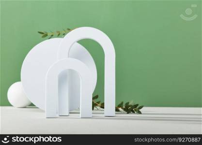 Abstract background with various geometric shapes and eucalyptus branches for product presentation front view