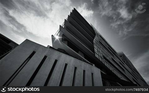 Abstract black and white low angle view of modern triangle architecture structure building .