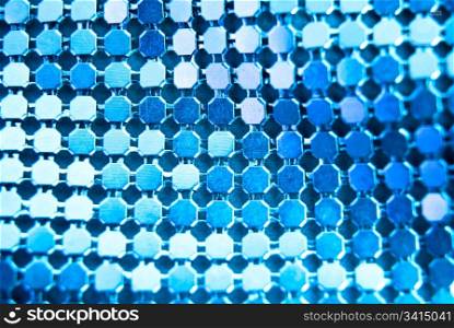 Abstract blinking background.Fabric texture with spangles.