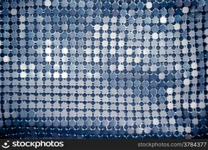 Abstract blinking background.Fabric texture with spangles.