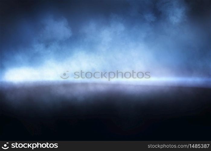 Abstract blue mist texture. Smoke illuminated by beam of light. Empty scene.