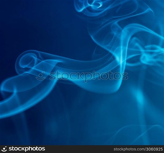 Abstract blue smoke on dark background