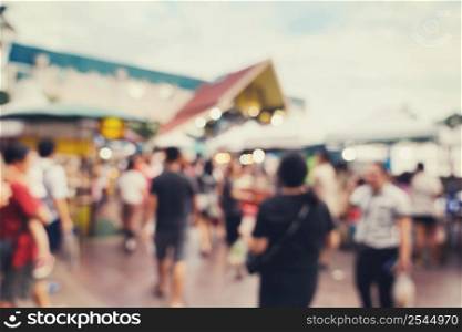 Abstract blur background in night market at shopping mall for background, Vintage toned.