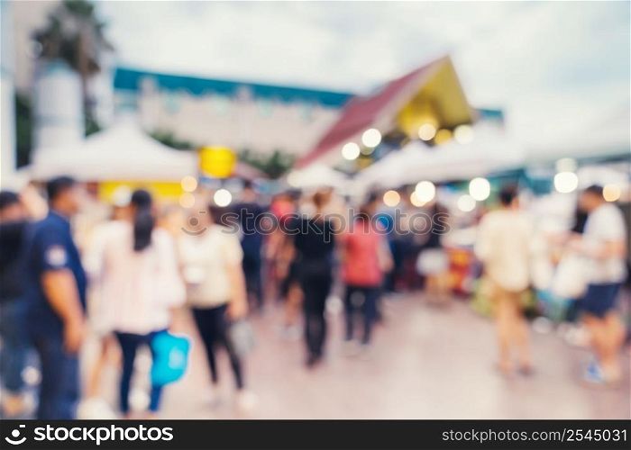 Abstract blur background in night market at shopping mall for background, Vintage toned.