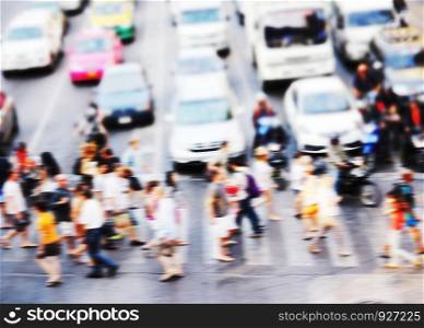 Abstract blur background of people are crossing road at the crosswalk