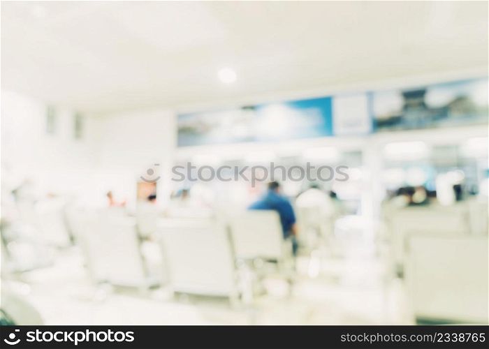 abstract blur background of people sitting and walking in hospital.