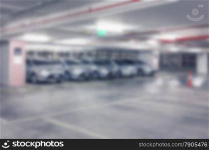 Abstract blur background of Vacant or empty space of car parking lot at night, shallow depth of focus