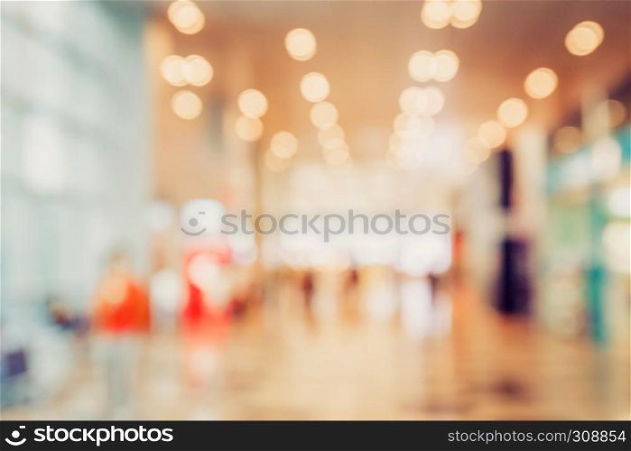 abstract blur bokeh light in department store colorful background concept.
