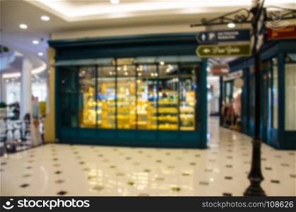 Abstract blur department store with shopping mall interior for background.Use as background image.