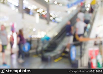 Abstract blur escalator in shopping mall interior for background