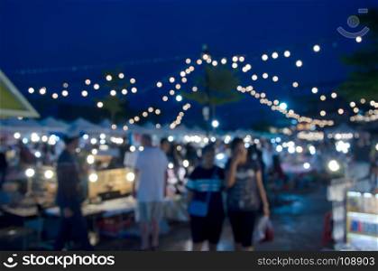 Abstract Blur Festival Events Market Outdoor With People walking night market for background usage.