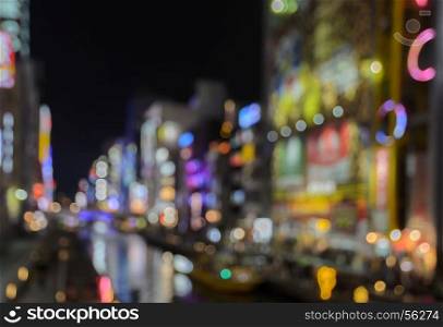 Abstract blur Illuminated billboards of store and restaurant at night in Osaka, Japan