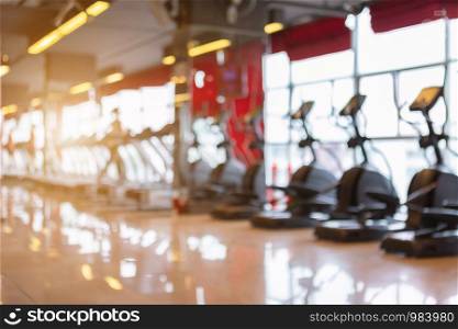Abstract blur of defocused sport gym interior and fitness health club with sports exercise equipment Gym blur background.